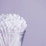 Grooming Tools - white cotton buds in container