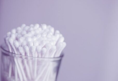 Grooming Tools - white cotton buds in container